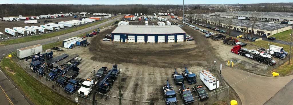 Elevated panoramic view of Eastland Towing's 20 acre secure fenced storage lot.